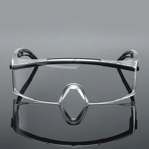 Detail of safety goggles featuring black plastic frame and anti-slip temple design