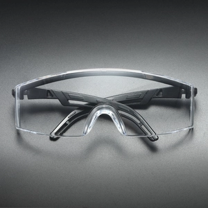 Detailed view of anti-fog clear lenses and ergonomic black frame of safety glasses