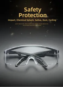 Detail of protective safety goggles featuring transparent anti-fog lenses and black frame
