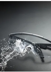 Detail of safety goggles with black frame and PC lenses against water splashes