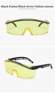 Detail of yellow anti-fog safety glasses with ergonomic black frames and anti-impact lens