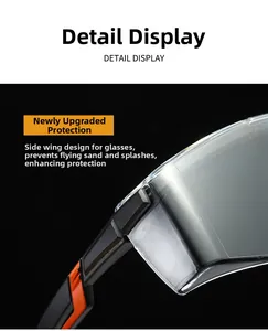 Detail view of anti-fog safety goggles with protective side wings and dual-color temples