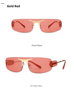 Détails de lunettes de soleil sans monture à verres rouges avec garnitures dorées en métal