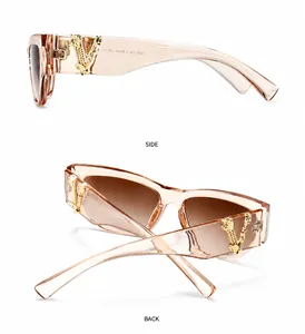 Detail der Retro-Sonnenbrille mit goldenem V-Metallscharnier und braunen Verlaufsgläsern