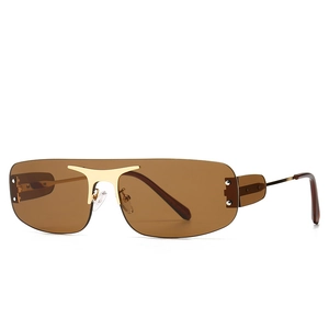 Lunettes de soleil oversize sans monture, verres bruns et pont doré style cornes