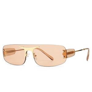 Lunettes de soleil sans monture modernes avec verres ambre et pont en métal doré ailé