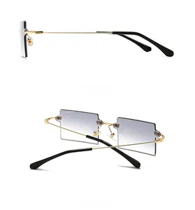 Side and back view of frameless rectangular sunglasses with grey gradient lenses
