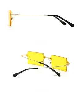 Side and back view of retro square rimless sunglasses with yellow lenses and gold temples