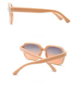 Detail view of pink chunky sunglasses with purple and orange gradient lenses