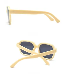 Detail view of cream square sunglasses featuring dark lenses with side and back perspectives