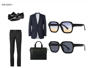 Flat lay of luxury business attire featuring square sunglasses and leather briefcase