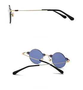 Side and back view of retro rimless sunglasses with gold frames and blue lenses