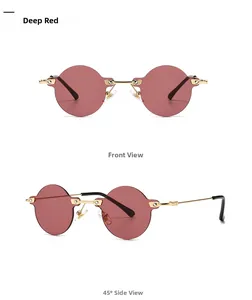 Close-up of deep red rimless round sunglasses with gold metal frame and temple detail