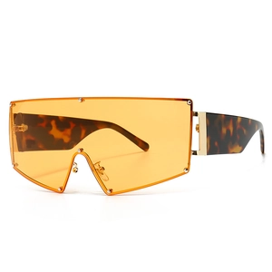 Lunettes de soleil bouclier surdimensionnées avec verres orange et branches en écaille