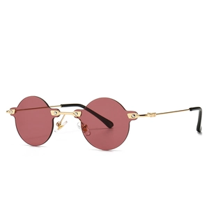Retro round rimless sunglasses with pink lenses and gold metal frame for trendy streetwear