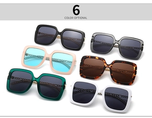 Detail of square oversized sunglasses in 6 colors with gold chain temple design