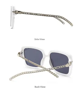 Detail of square white frame sunglasses featuring vintage gold metal chain temples
