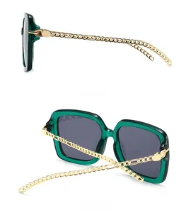 Side and back view of oversized square sunglasses with gold chain temples