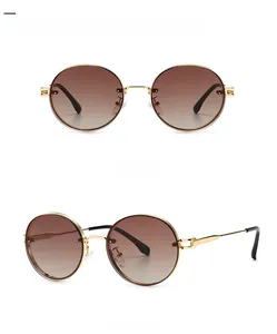 Front- und 45-Grad-Seitenansicht der ovalen Sonnenbrille mit Goldrahmen und braunem Verlauf