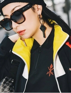 Close-up of trendy wide-leg sunglasses with tortoise pattern and fashion accessories