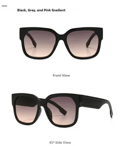 Detail of square sunglasses showing wide black frames and grey to pink gradient lenses