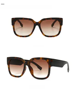 Detail shot of vintage tortoiseshell sunglasses with brown gradient lenses and wide temples