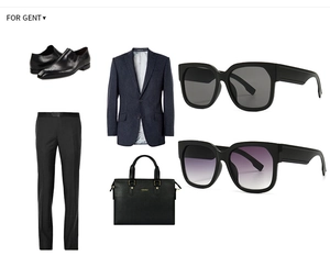 Flat lay of retro square sunglasses with deep blue pinstripe blazer and leather bag