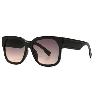 Classic oversized square black sunglasses with trendy gradient brown-red lenses