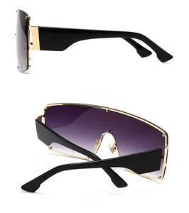 Detail view of large punk sunglasses with gradient purple lenses and wide black temples