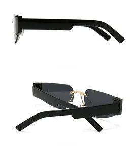 Macro view of retro square sunglasses with wide black temples and gold metal bridge