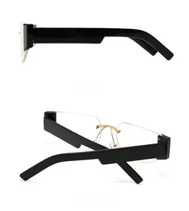 Detail of semi-rimless rectangular sunglasses featuring thick black temples and gold bridge
