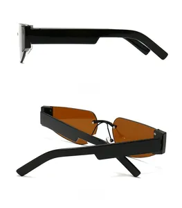 Detail view of the side and back of black rectangular sunglasses with brown lenses
