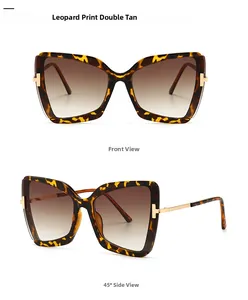 Detailansicht der Schmetterlingsbrille mit Leopardenmuster und goldener T-Metall-Verzierung
