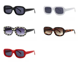 Detailed view of narrow square sunglasses in zebra and tortoise patterns