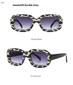 Macro view of retro square tortoise shell frame sunglasses with purple gradient lenses