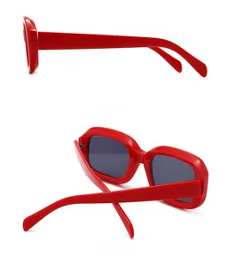 Side and back view of narrow square red frame sunglasses with dark lenses