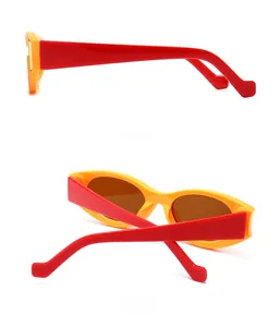 Detail view showing side and back angles of vintage red and yellow retro sunglasses