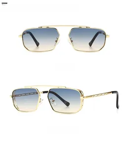 Detail of golden square sunglasses with blue-tan gradient lenses and hollow metal temples