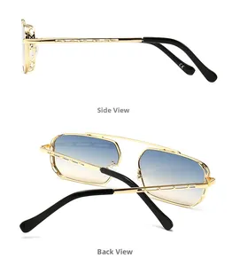 Detail view of gold metal sunglasses frames with hollow geometric arms and gradient lenses