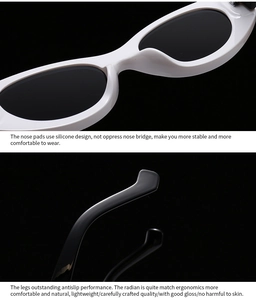 Detail view of white frame vintage sunglasses with silicone nose pads and glossy black temples