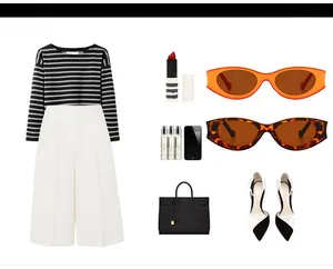 Flat lay of vintage cat eye sunglasses with chic striped knit top and wide-leg trousers