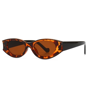 Vintage oval sunglasses with tortoiseshell frames and brown lenses in a 45-degree angle view