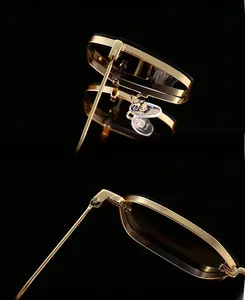 Detail of premium gold metal frame sunglasses featuring thick UV400 protective lenses