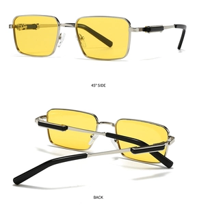Detail view of square silver metal sunglasses with vintage yellow tinted lenses