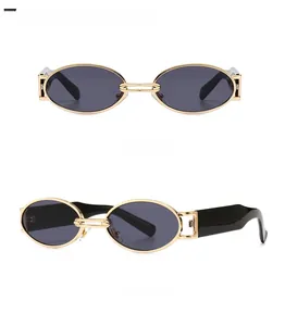 Front and side view of vintage golden metal oval sunglasses with black grey lenses