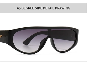 Detail of modern black sunglasses with gradient grey lenses and golden metal hinge