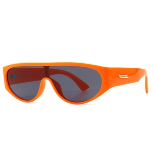 Modern retro orange wrap sunglasses with grey lenses and gold metal temple details