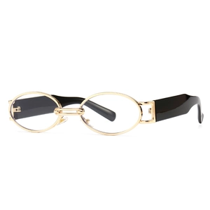 Retro oval sunglasses with gold metal frame and black temple tips on white background