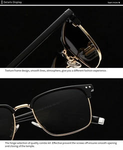 Close-up of polarized sunglasses with black frame, gold metal hinges and rivets