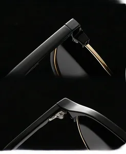 Close-up of black acetate frame with gold metal hinges and reinforced screws